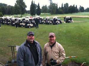 In September, Science Applications International Corporation golfers Dan Starr (r) and Bo Goff gear up to show their support for scholarships at the chapter's annual golf tournament.